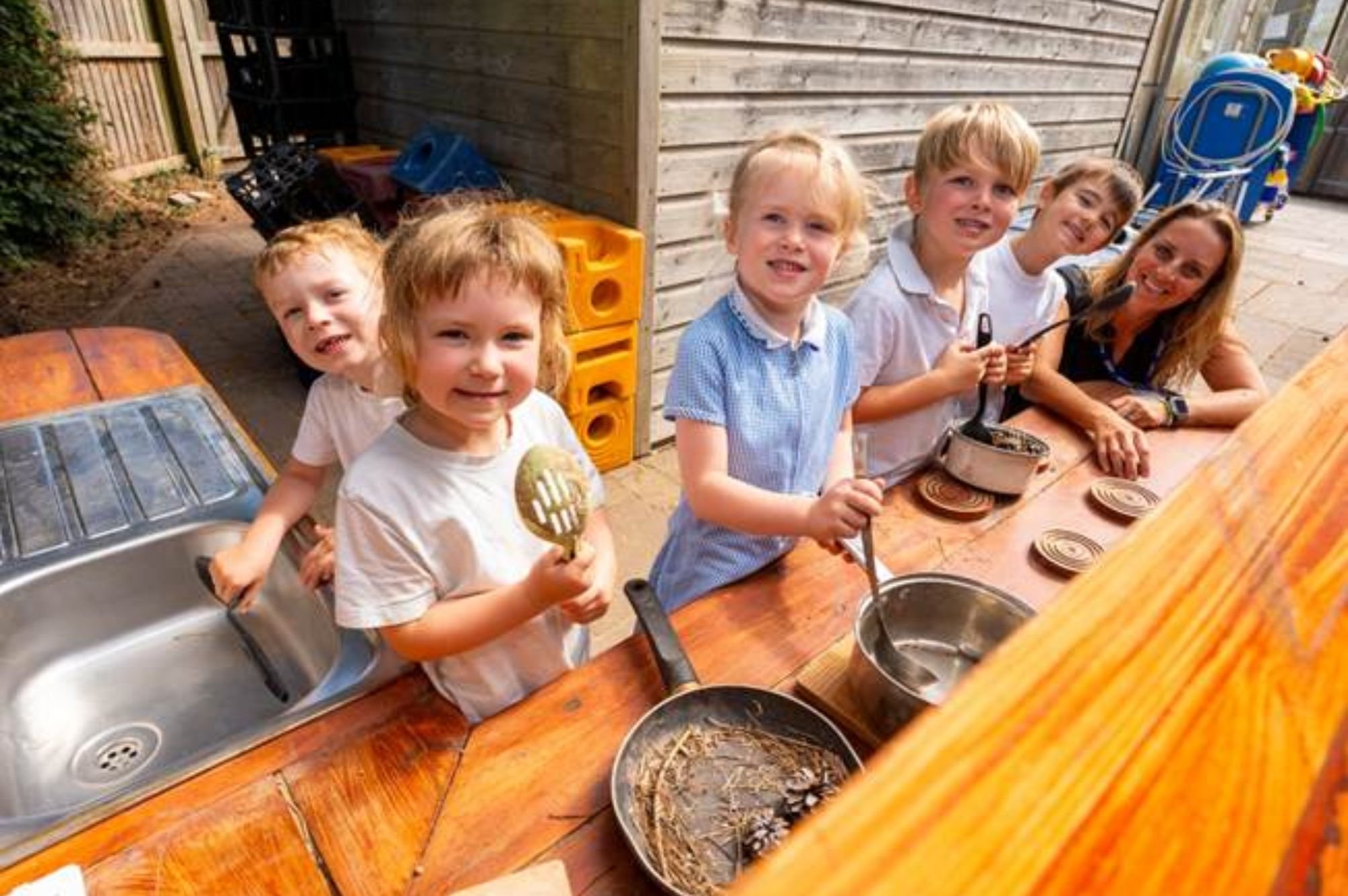 Pupils enjoying the mud kitchen