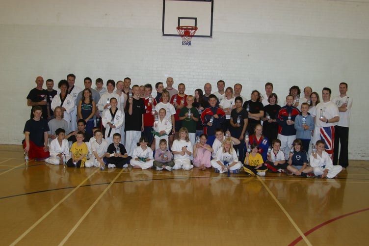 Members of Devon Tae Kwon Do students and instructors who took part in a Kick Cancer Sparathon session at Lords Meadow Leisure Centre in June 2005. 263-6355_IMG