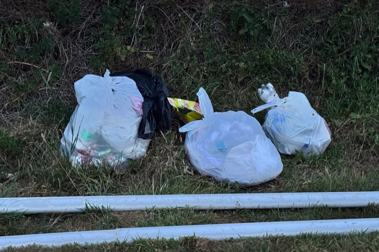 Rubbish left behind has been bagged by the travellers. AQ 6330