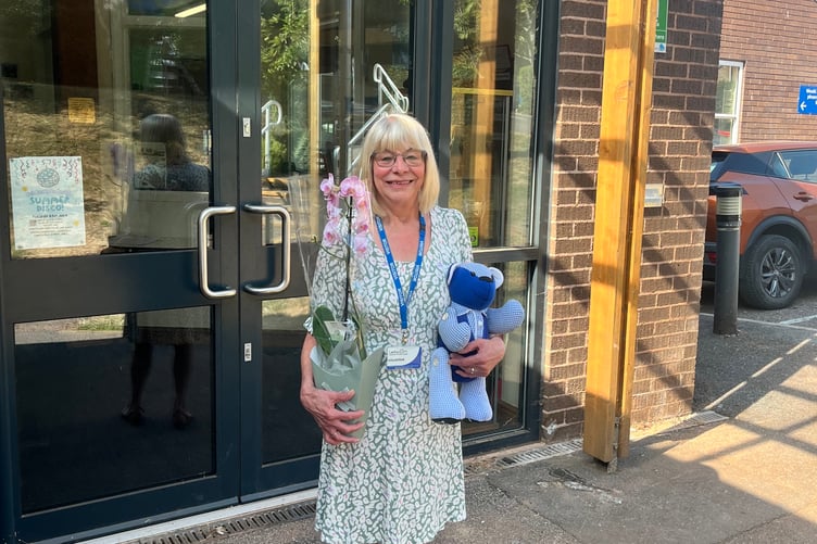 Yvonne with some of the gifts she received on her retirement from Landscore School in Crediton.