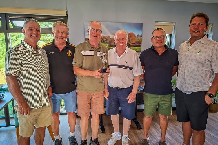 The winning team, Crediton Rugby Club with their President and the trophy. Images: Mike Palmer