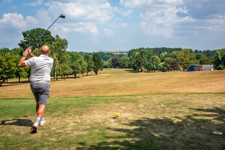 Beginning the round, driving off the first tee.