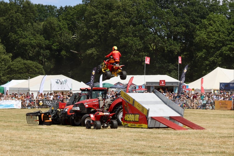 The Kangaroo Kid ATV stunt rider jumping over farm machinery