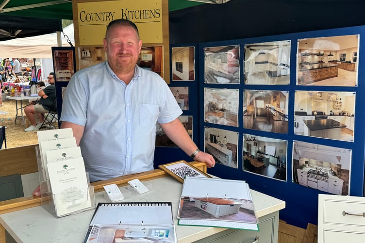 Mid Devon Show: Country Kitchens of Devon welcomed prospective customers to their stand. AQ 6529