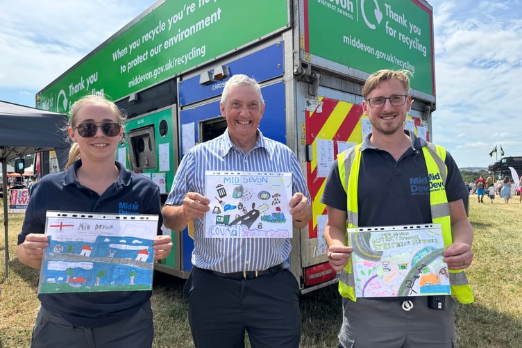 Mid Devon Show: Mid Devon Recycling ran a poster competition for children about recycling, MDDC Deputy Leader Guy Cochran, centre holding the winner, Kyle Dolbear, right, holding the second prizewinning entry and Sam Lockyer, left, with the third prizewinning entry. AQ 6451