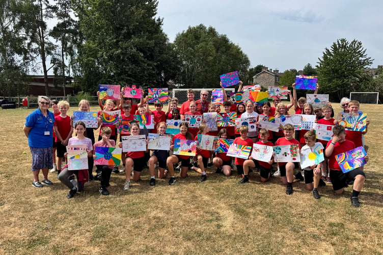 The Hayward’s Primary School children with their peace posters. AQ 5451