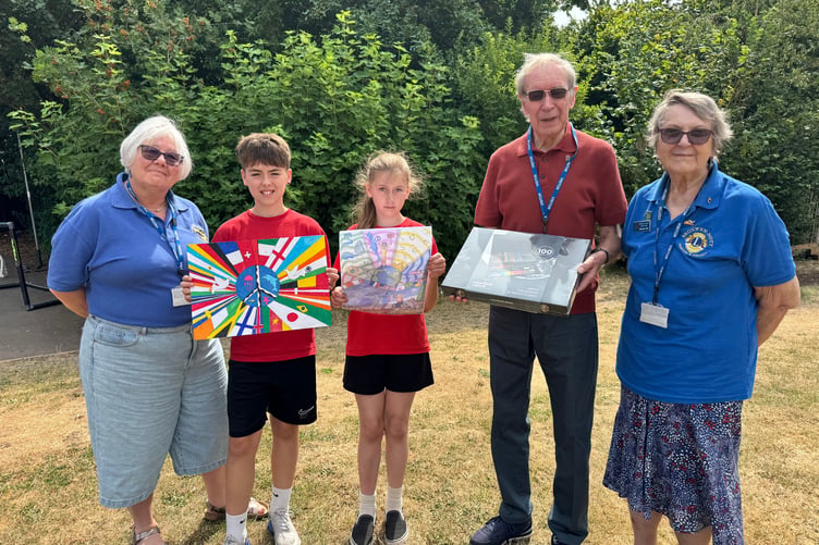 The Hayward’s Primary School peace poster winner Jessica, centre with runner-up Jacob and Lions Anne Whitehouse, Eric Parkes and Bronwyn Nott. AQ 5456