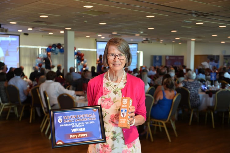 Mary Avery with her Devon FA long service award.