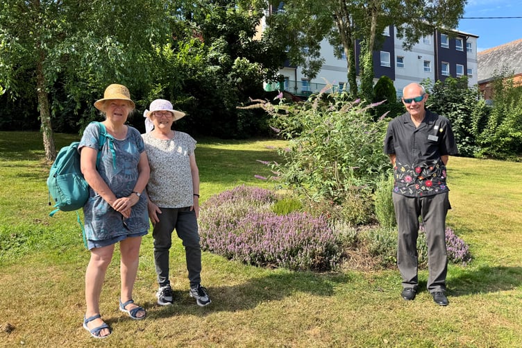Sustainable Crediton members and the South West in Bloom judge in Newcombes Meadow. AQ 5484