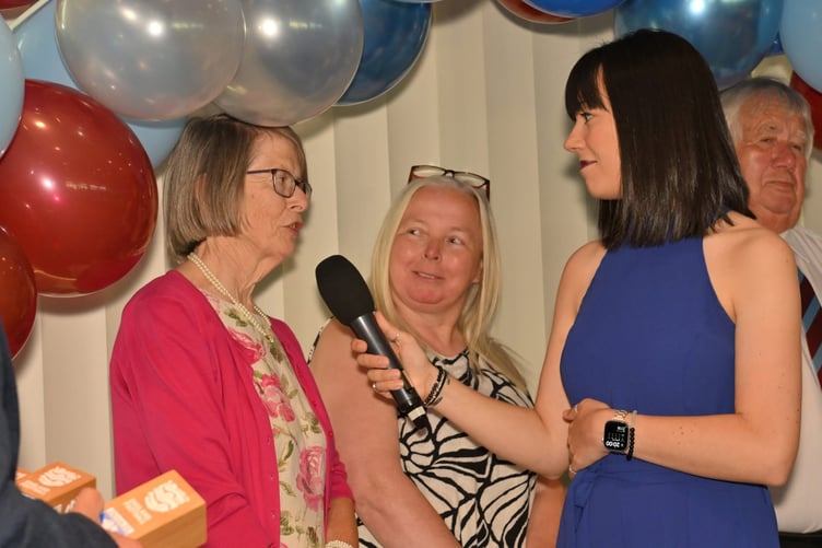 Mary Avery being interviewed on stage after receiving her award.