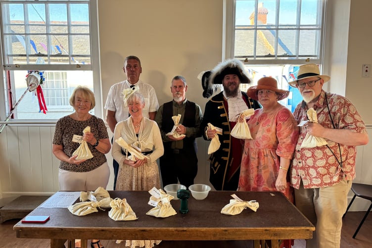 Ready to throw coins out of the Town Hall windows for the money scramble, some of the town dignatories and Chulmleigh Fair committee members. AQ 6814