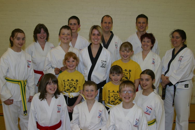 Instructor Becky Brooks, centre, with some of the grading recipients and members of Crediton TAGB Tae Kwon Do group in March 2005. 245-4571_IMG