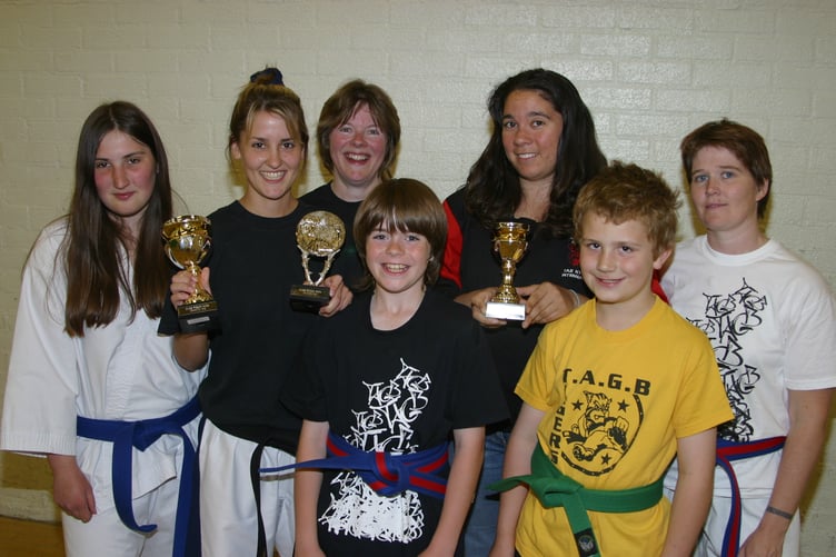 Becky Brooks, second from left, with students who took part in a Welsh Taekwondo Championship in Cardiff in May 2004. 191-9123_IMG