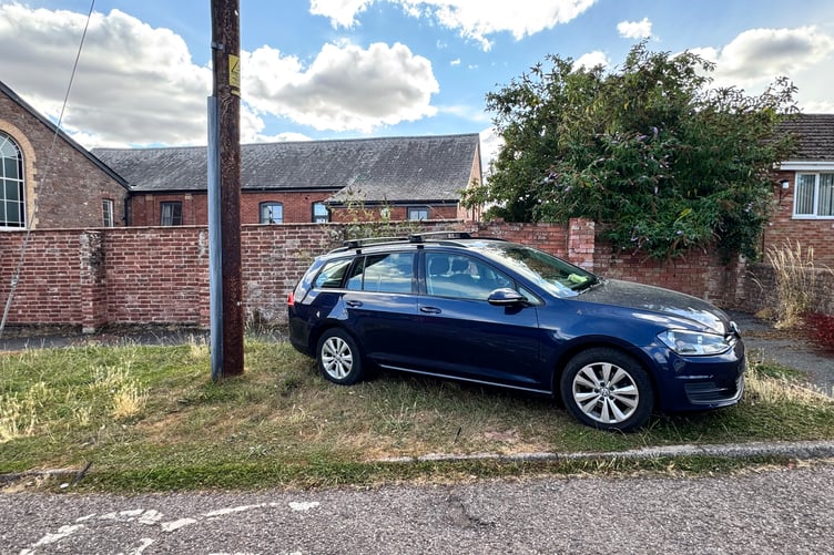 The car parked on a grass verge at the bottom of Waresfoot Drive. AQ 7735