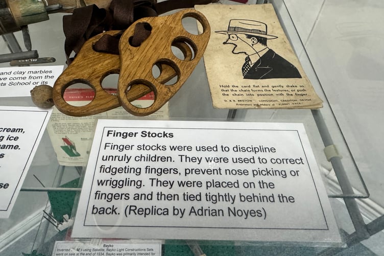 Finger Stocks on display at Crediton Museum. AQ 8655