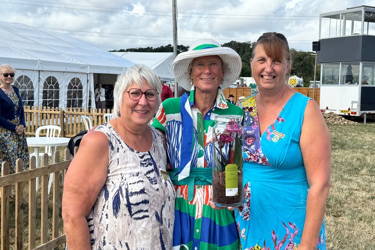 There was a gift for the President Grania Phillips, centre, presented by Assistant Show Secretary Kerry Woollcott, left and Show Secretary Theresa Soanes. AQ 7613