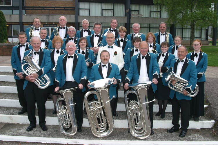 Crediton Town Band, with Musical Director Chris Richards, centre, who were celebrating after being selected to play at Euro Disney in Paris in May 2004. 185-8503_IMG