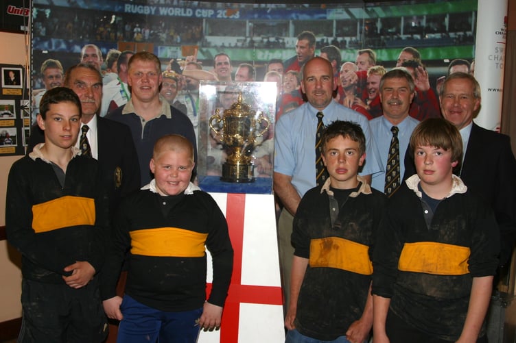 Members of Crediton Rugby Club posed for a photo with the Webb Ellis trophy at Crediton in May 2004. 183-8345_IMG
