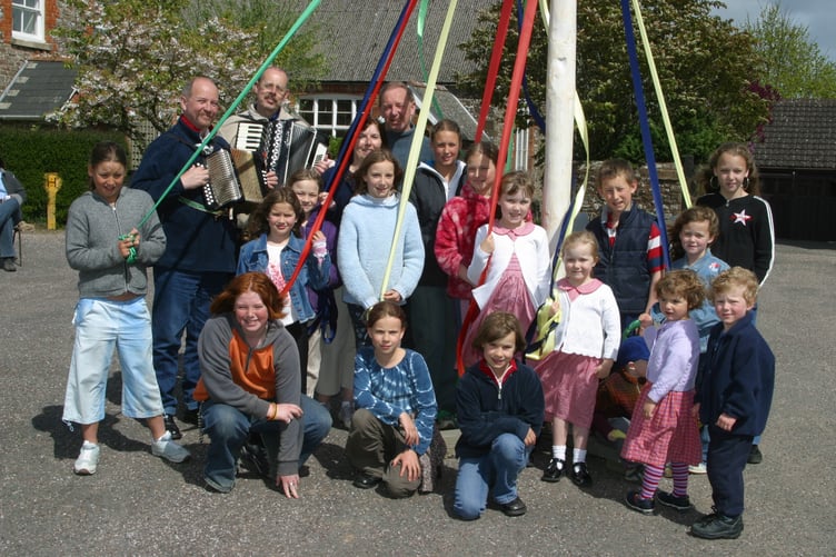 Some of the children who enjoyed maypole dancing at Coldridge, with musicians and organisers in May 2004. 185-8515_IMG