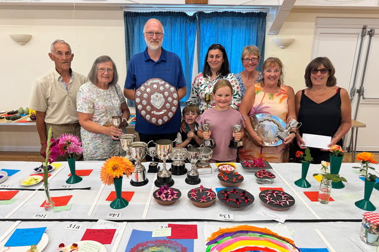 Trophy winners at Spreyton Flower, Produce and Crafts Show including Ian Pinwell with his 8 trophies with chairman Tony Talbot, left, and Secretary, Sharon Hawking, back right.
