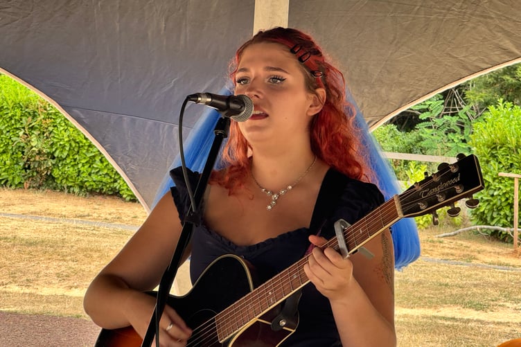 Singer-songwriter Jessie Hampson performing at Arts in the Park. AQ 9050