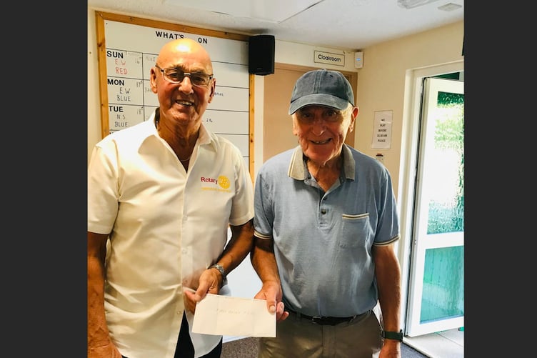 Colin Ladd was the winner of the raffle, presented by Paul Radnor, left.