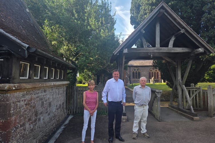 Sir Mel Stride MP, centre, with Diane Cridland and Alan Clark.