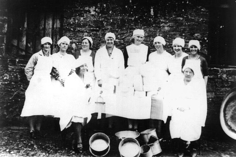 The Women's Institute Cheese-Making Group at Newton St Cyres Parish Hall in 1930.