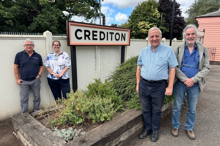 With the new heritage style Crediton name board, from left, Paul Bryant of Parc Signs; Melanie Harvey, Station Manager, Mid Devon, GWR; Richard Burningham and David Gosling. AQ 7653