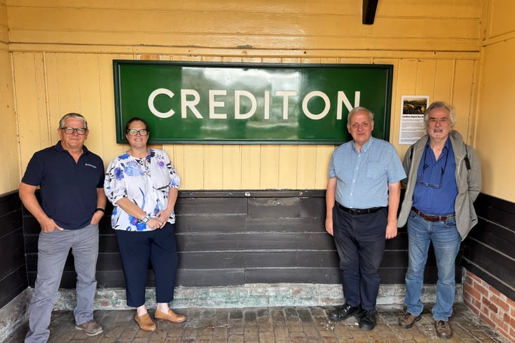 With the old British Rail enamel signalbox nameboard, from left, Paul Bryant of Parc Signs; Melanie Harvey, Station Manager, Mid Devon, GWR; Richard Burningham and David Gosling. AQ 7657
