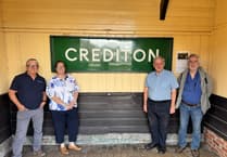 Old signalbox sign returned to Crediton station after nearly 50 years