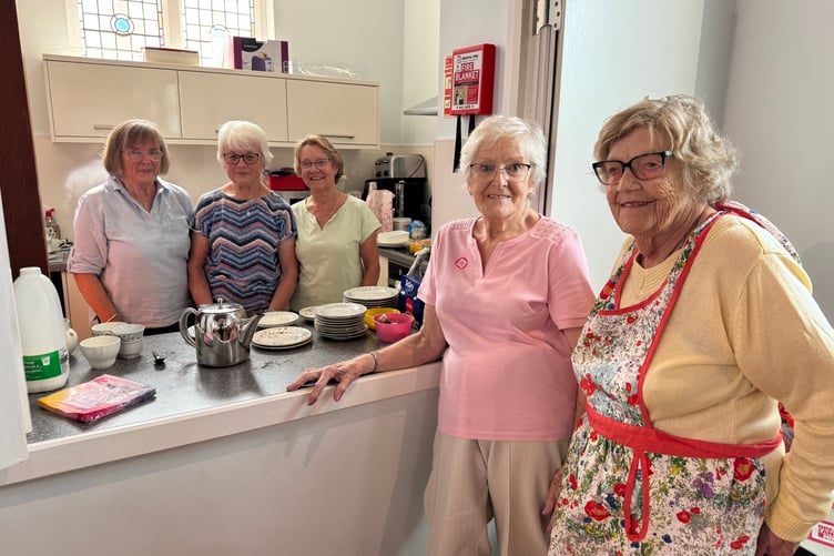 Kitchen helpers at the Breast Cancer Now Tea Party. AQ 9574