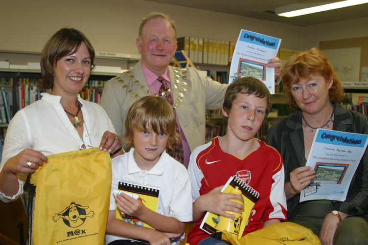 Andrew Campbell and Cameron Beer received prizes at Crediton Library after completing a fact-finding tour of Crediton, with Mayor of Crediton Cllr Bob Edwards and library staff in September 2006. IMG_8468