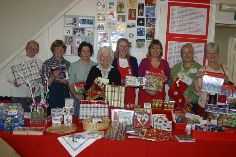 Behind one of the stalls at the Save the Children annual craft fair are helpers with President Lady Mills, centre, in October 2006. IMG_9597