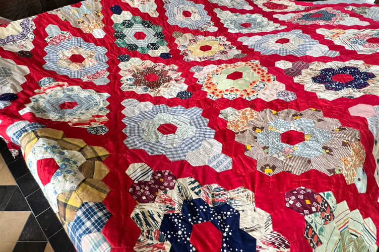 An antique quilt created by a Coldridge Quilting Club member’s great grandmother. AQ 0115