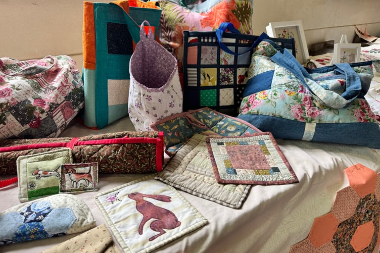 Quilted items on display. AQ 0111