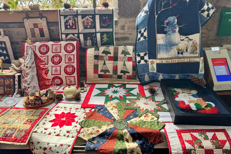 Some of the quilted Christmas items displayed. AQ 0127