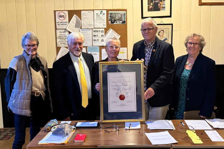Malcolm Vallance receiving his Certificate of Outstanding Achievement from Mid Devon Cllr Gwen DuChesne MBE with District Councillors Polly Colthorpe and Steve Keable, left, with former District Councillor Margaret Squires, right. AQ 9989