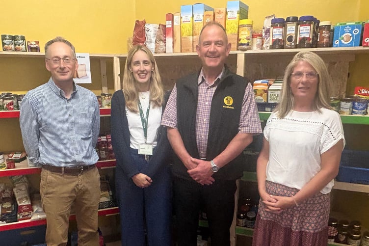 NFU Mutual Agents Jeremy Atkins, left, and Richard Pym with Crediton Foodbank Chair Keri Storey, right, and Coordinator Helen Moores
