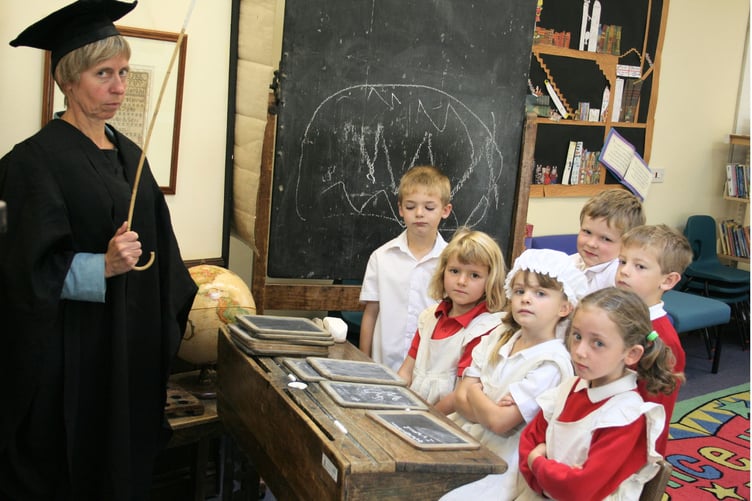 Pupils at Hayward's School were studying Victorian school times, with Mrs Bridget Merrett in teacher's gown and mortar board in September 2006. IMG_5155