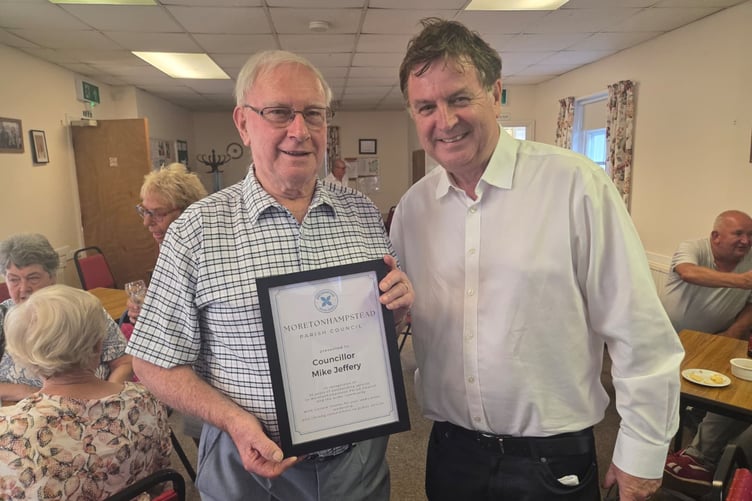 Mike Jeffery with his certificate of thanks and Mel Stride, MP for Central Devon.