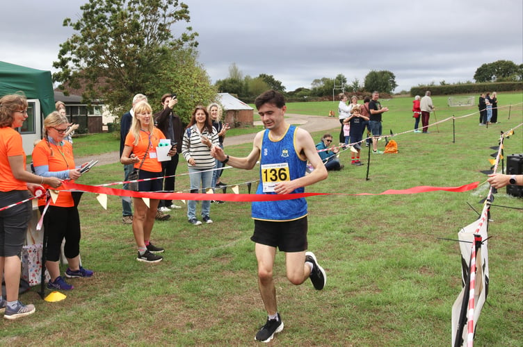 Winner Michael Lambourne crossing the finish line