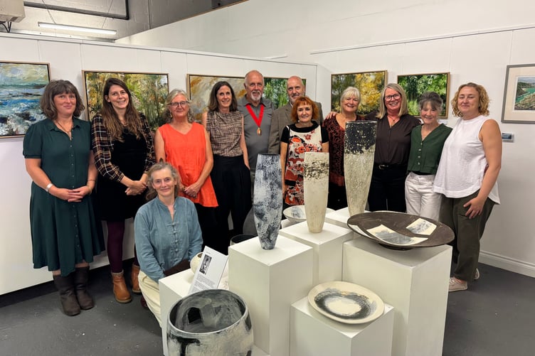 Some of the exhibitors of work at The White Room Creative Space, 50 Commonmarsh Lane, Lords Meadow Industrial Estate with the Mayor of Crediton, Cllr Steve Huxtable and Bindy Saywood, of The White Room. AQ 0772