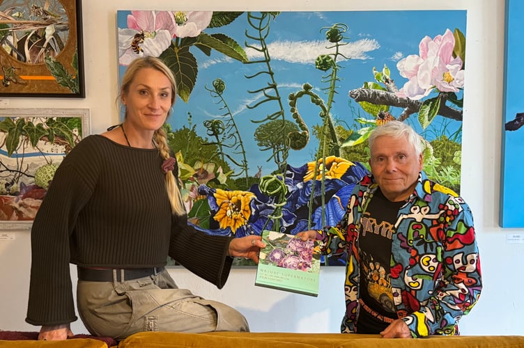 Monika Przerwa Tetmajer of Art Plus Frames Gallery with John Hurford in front of some of his works. AQ 0691
