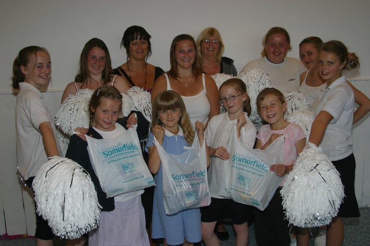 Crediton Greensword Majorettes raised funds by helping shoppers pack their bags for donations at Somerfield in June 2007. IMG_5927