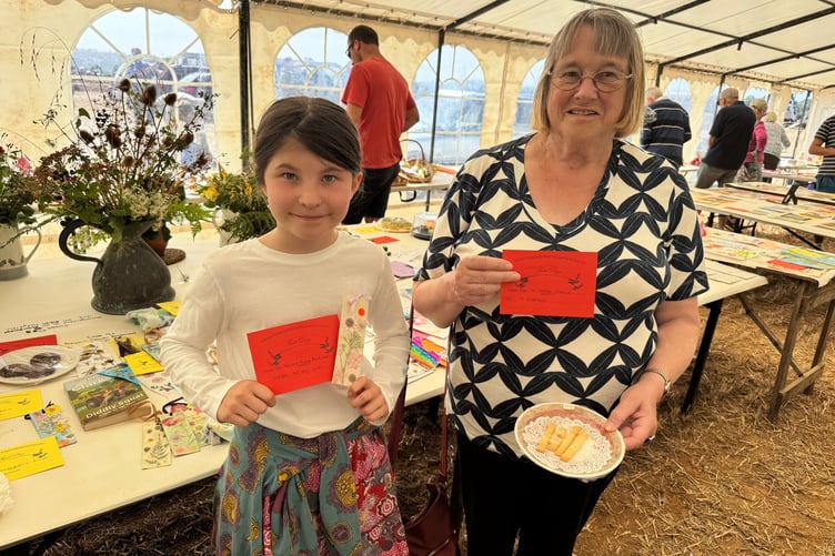 Hester McVey Jones (9) had a first with a pressed flower bookmark and Hazel Cheriton had a first with cheese straws at Cheriton Fitzpaine. AQ 1527