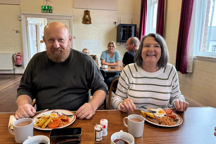 Tucking in at the Lapford Big Breakfast in aid of Children in Need. AQ 1172