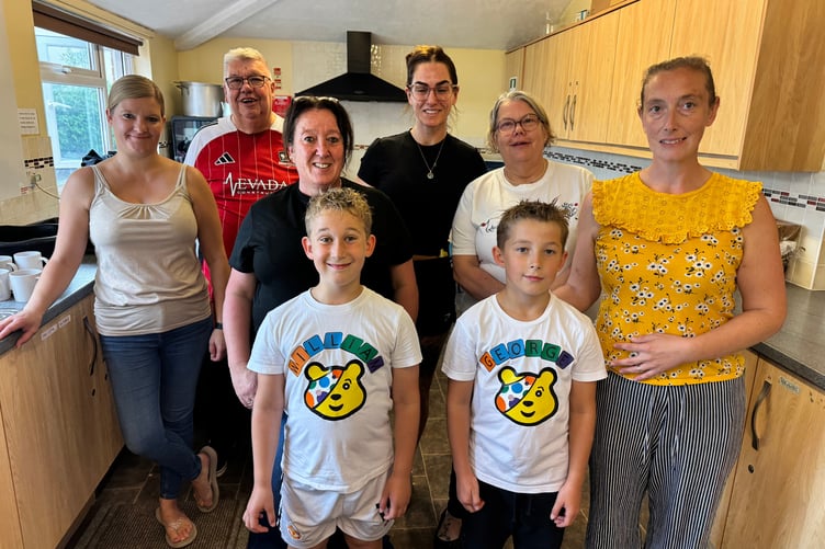 William and George with family and helpers in the kitchen for the Big Breakfast in aid of Children in Need. AQ 1157