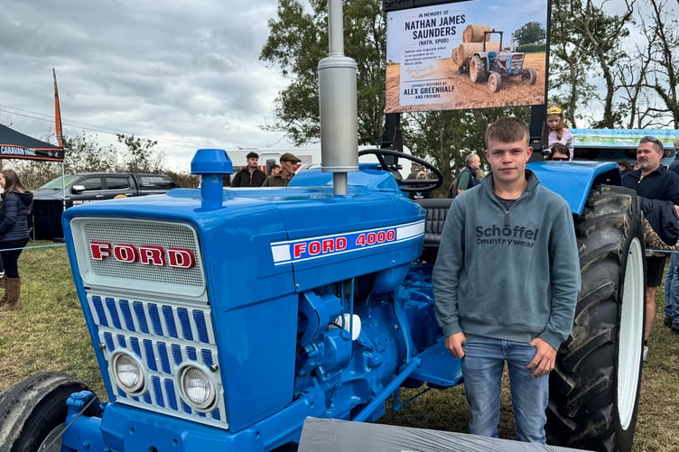 Alex Greenhalf beside Nathan’s tractor which he finished restoring in Nathan’s memory. AQ 1966