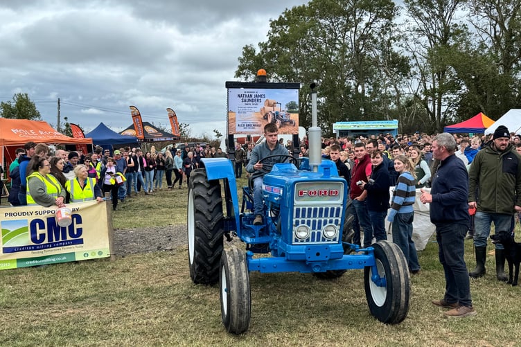 Alex Greenhalf drives Nathan’s restored tractor to the Memorial Run start. AQ 1998